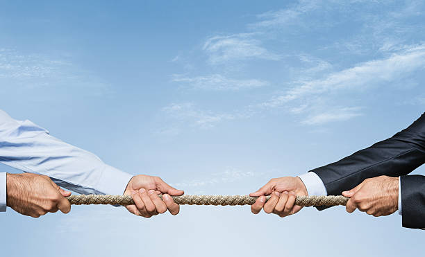 men pulling rope